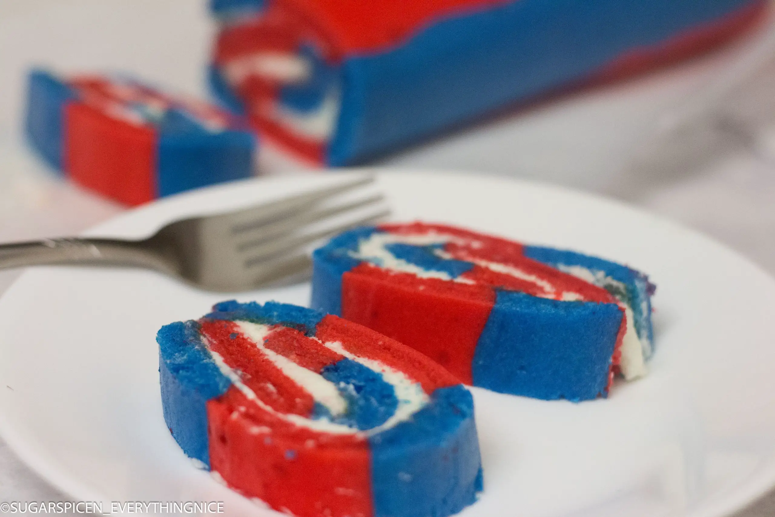 Swiss Roll in Red and Blue with white whipped cream