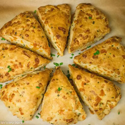 8 cheddar and chive scones kept in a circle