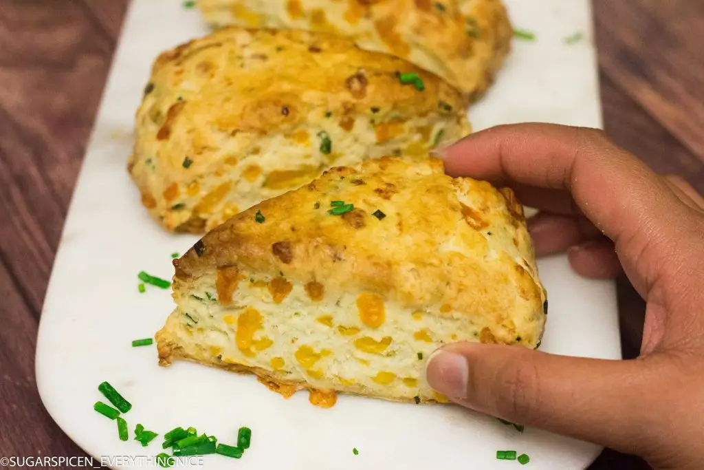 cheddar and chives scones kept on a marble board
