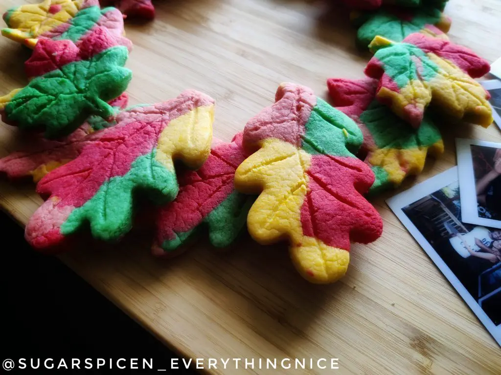 fall leaf cookies on a wooden board