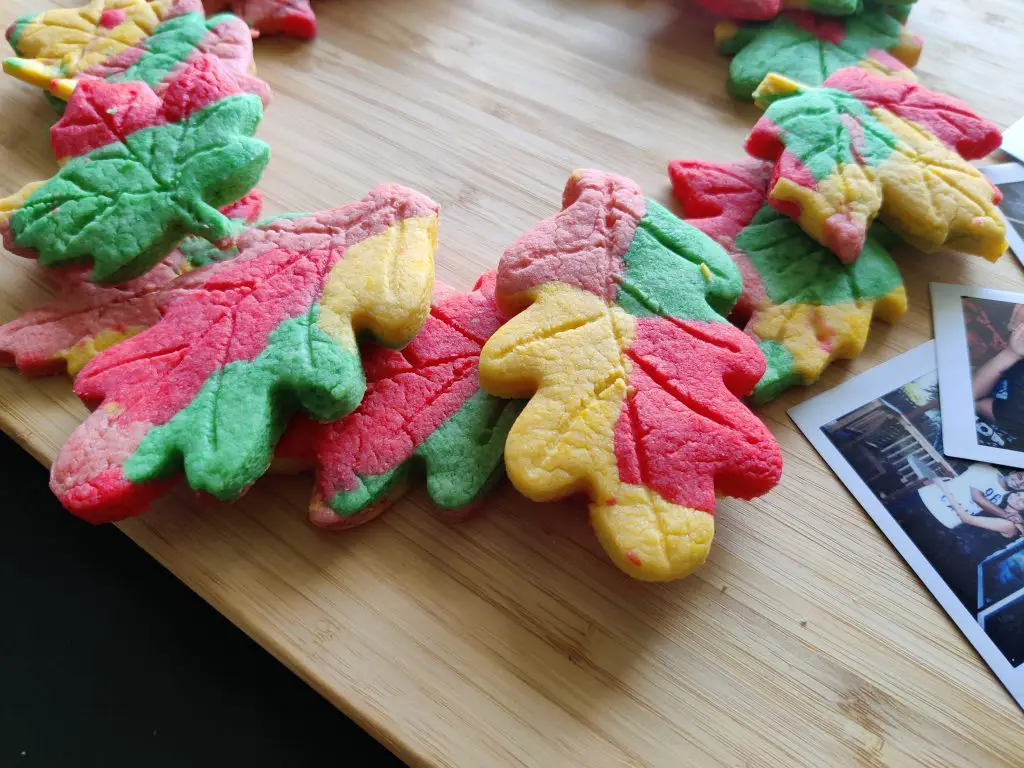 Maple leaf shaped & colored cookies placed laid out as a wreath