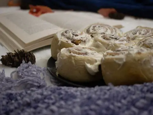 cinnamon rolls kept in front of the book