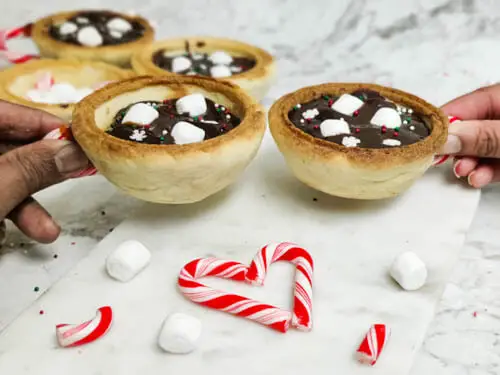 hot chocolate sugar cookie cups with peppermint candy cane