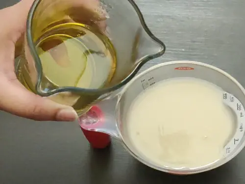 adding oil to milk + vinegar mixture
