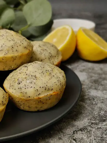 lemon poppy seed muffin - on black plate