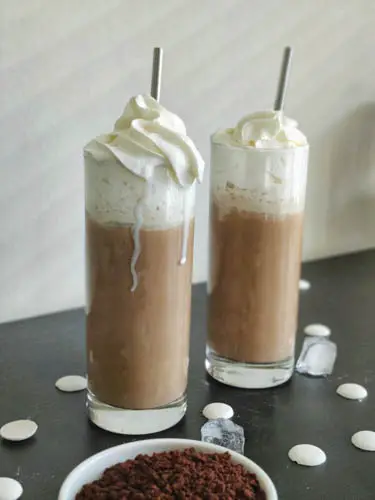 white chocolate mocha drink with melting whipped cream