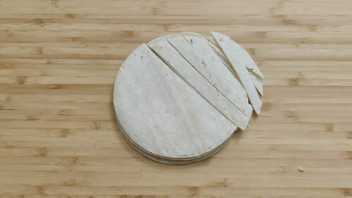 cutting tortilla in strips