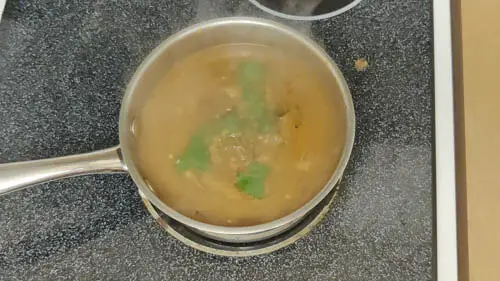 simmering the soup after adding parsley and bouillon