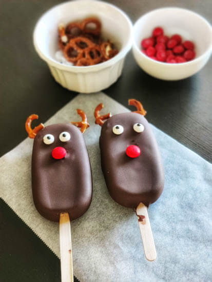 2 chocolate ice cream bars kept on a parchment paper