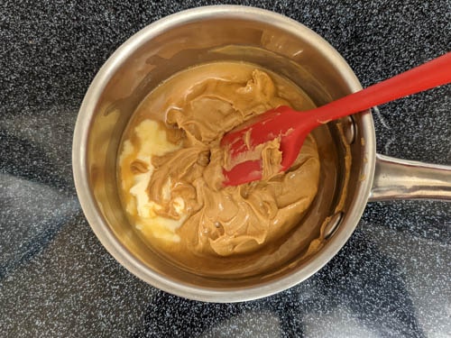 melt peanut butter and butter in small saucepan