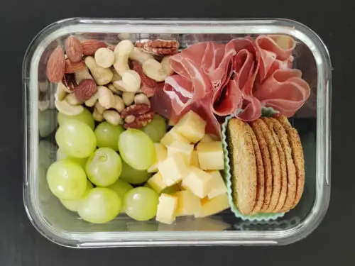 adult lunchable - prosciutto, grapes, nuts, cheese, crackers