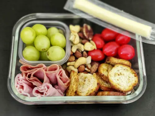 adult lunchable - ham, grapes, nuts, cherry tomatoes, bagel bites, string cheese