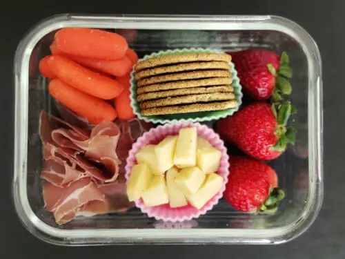 adult lunchable - prosciutto, carrots. strawberries, cheese, crackers