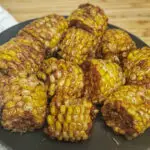 wingstop cjaun fried corn on a black plate