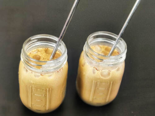 2 mason jars filled with protein coffee